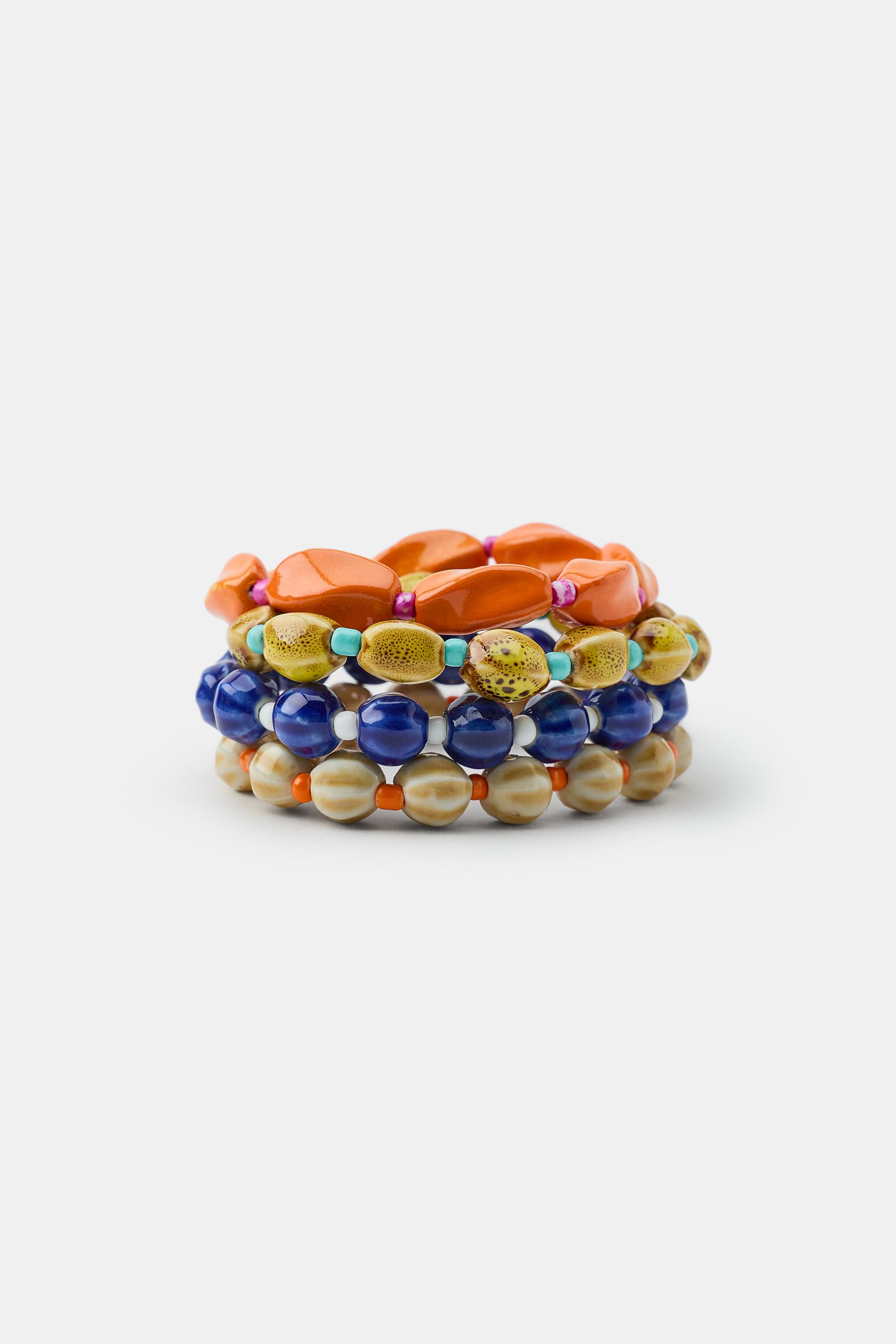 LOT DE 4 BRACELETS BOULES CÉRAMIQUE COQUILLAGE